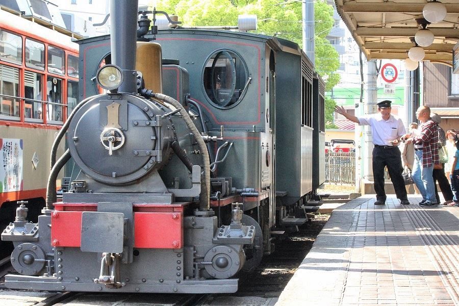 Dogo Onsen Station boarding Botchan train