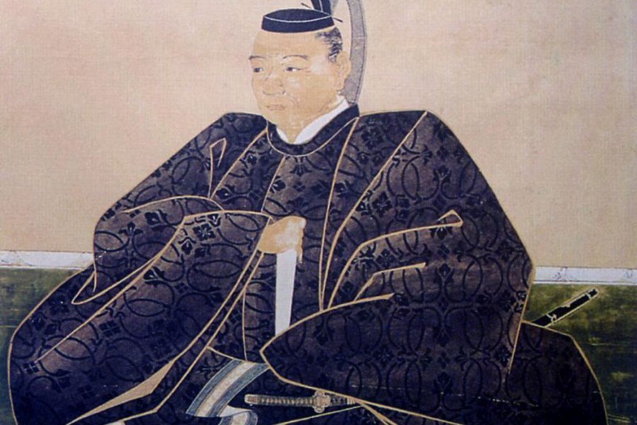 Kato Yoshiaki in armour seated