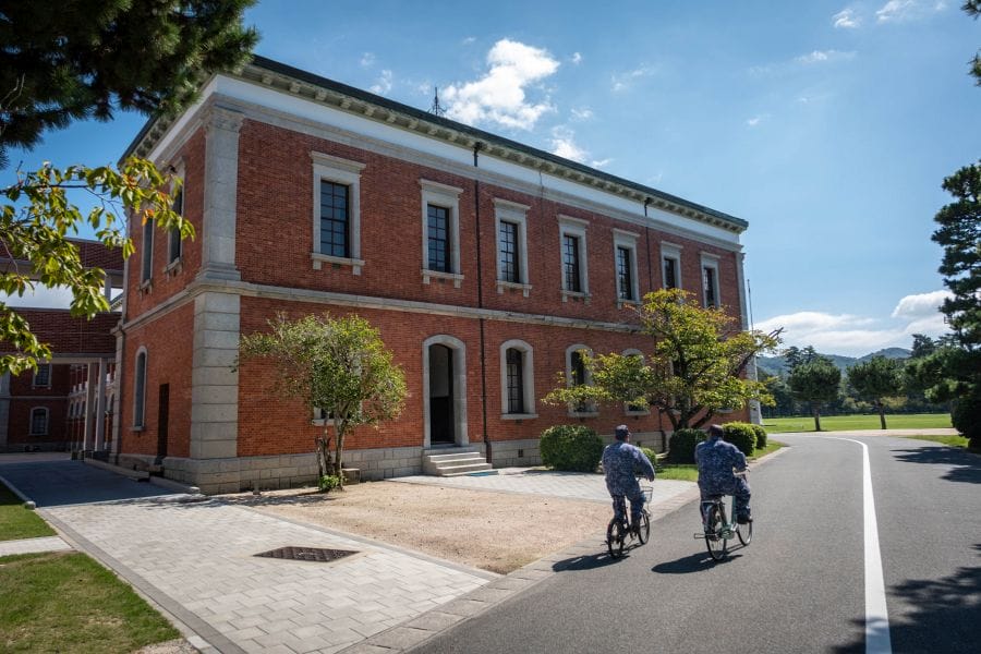 Etajima Naval Academy main building side non-coms on bicycles