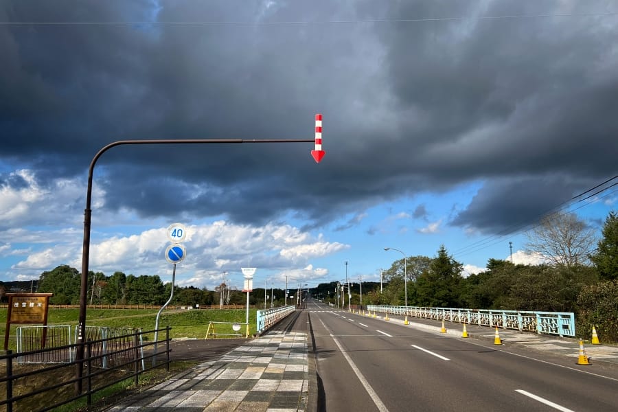 Akan, red snow arrow and dramatic sky